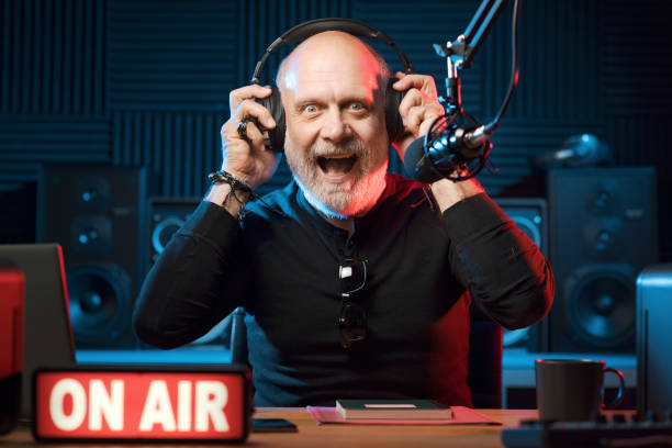 istock Surprised radio presenter working in the studio 1665617459