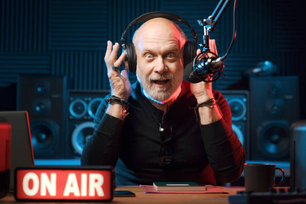 istock Surprised radio presenter working in the studio 1665623750