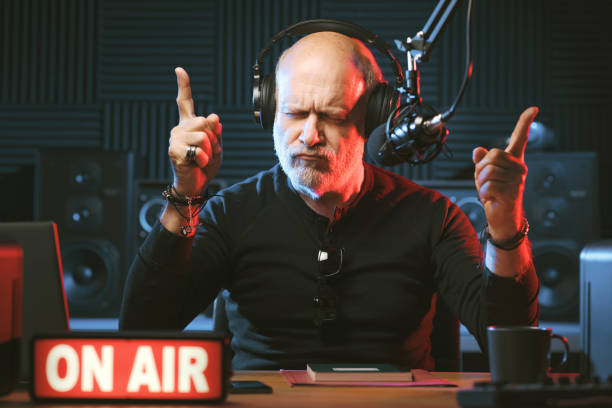 istock Radio host listening to music 1665626105
