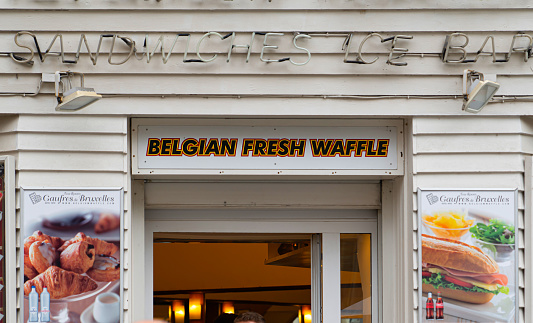 Brussels, Belgium - June 27 2023: The name of a shop that sells Belgian waffles.