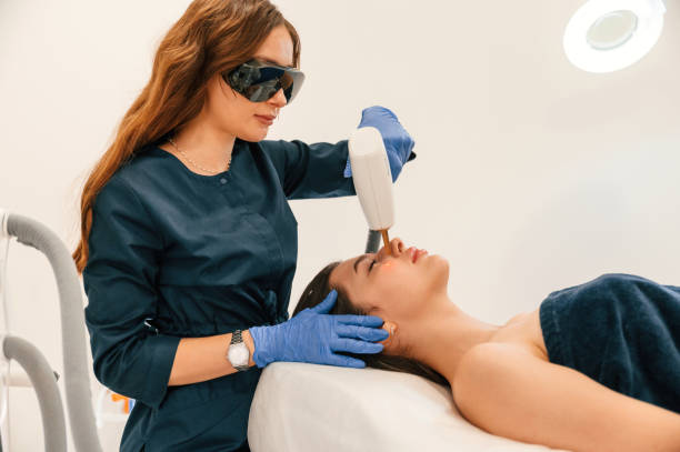 istock Lying down. Getting photo rejuvenation procedure at cosmetology clinic 1665639864