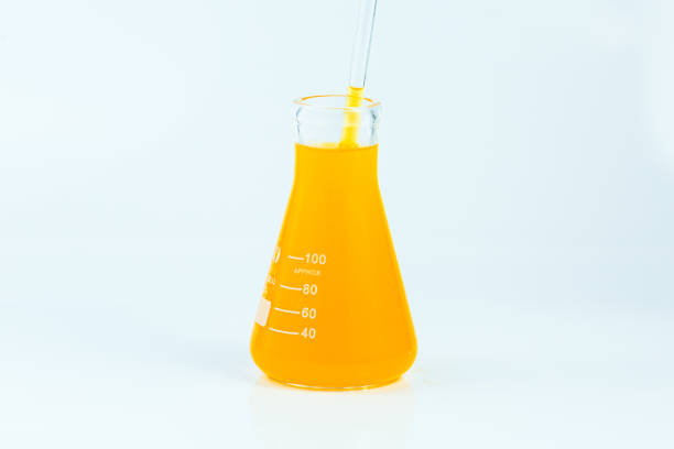istock Orange science test tube isolated on white background,Isolated Laboratory Erlenmeyer Flask with liquids of orange color , on white background. 1665661363