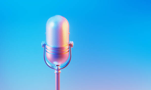 istock Microphone Illuminated By Blue And Pink Lights On Blue And Pink Background 1665665859