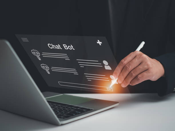 istock A businessman is using a pen to write a question that he wants an AI to answer. Chatbot system concept. AI concept 1665678408