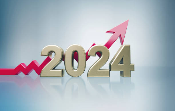 Red Arrow And Gold Colored 2024 Sitting Over Gray Background