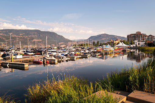 Kelowna city water sports marina at Stuart Park on Okanagan Lake in British Columbia, western Canada with moored boats and kayaks