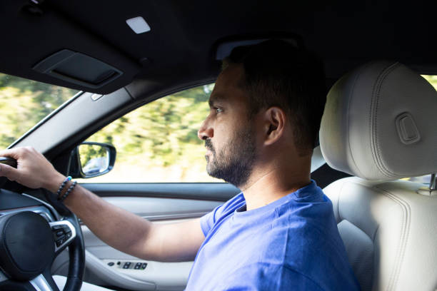 istock Man driving a car with motion bur 1665691853