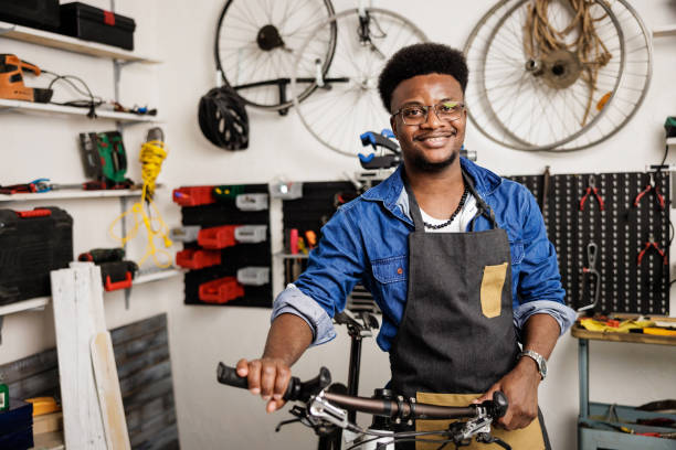 istock Smiling owner of bicycle workshop posing for camera 1665694191