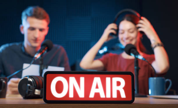 istock Young radio hosts working in the studio 1665697006