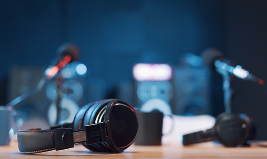 Radio broadcasting station professional equipment: headphones in the foreground