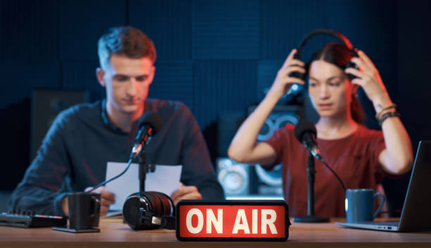 istock Young radio hosts working in the studio 1665702497