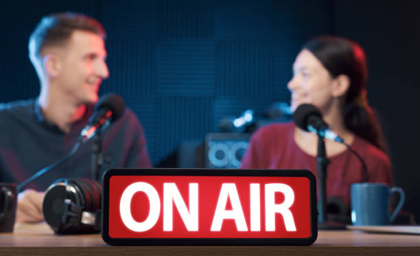 istock Young radio hosts working in the studio 1665703667
