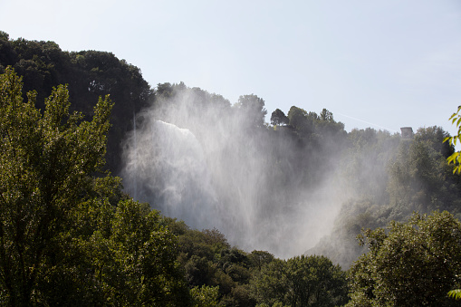 View of the waterfall from the forest, terni, italy