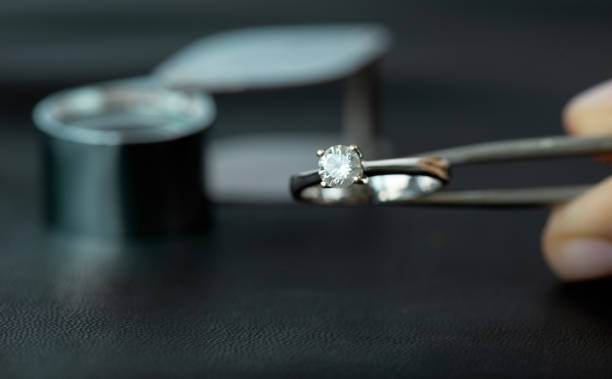 istock Jeweller Looking Diamond Ring 1665714431