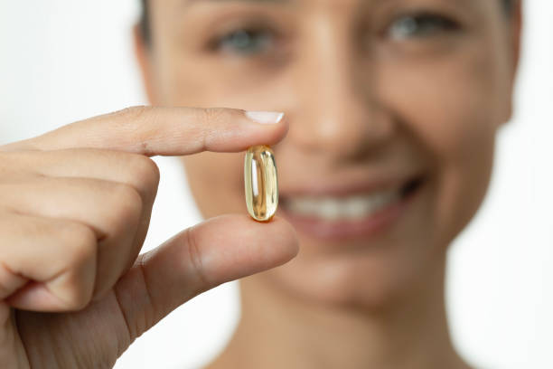 istock Woman with Soft Gel Capsule 1665726182