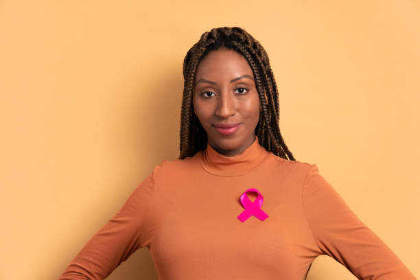 istock black woman showing pink ribbon 1665737931