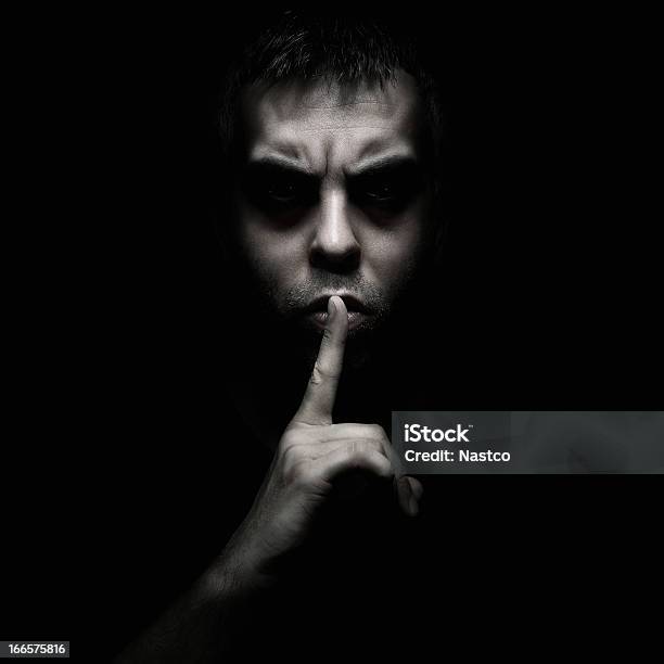 A Man Telling Someone To Be Silent Stock Photo - Download Image Now - Finger on Lips, Conspiracy, Men