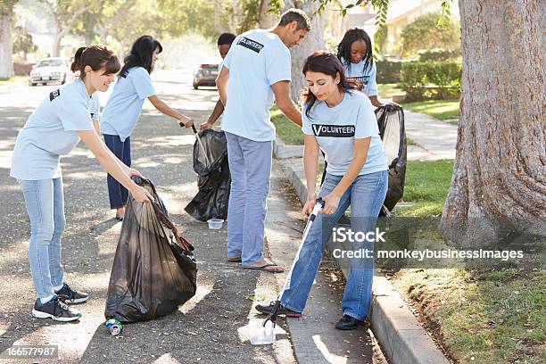 Volunteers Cleaning Up Litter Stock Photo - Download Image Now - Cleaning, Street, Community