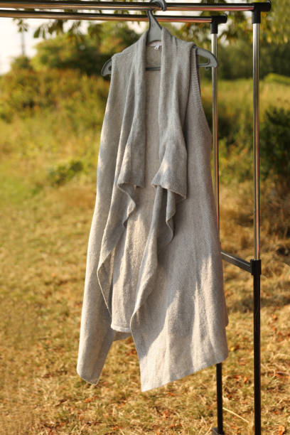 istock A gray sleeveless sweater hangs on a hanger. 1665790800