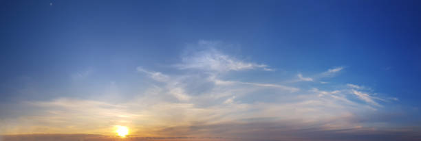 istock Orange sun and blue sky with cloud, dramatic sunny atmosphere wallpaper background 1665794117