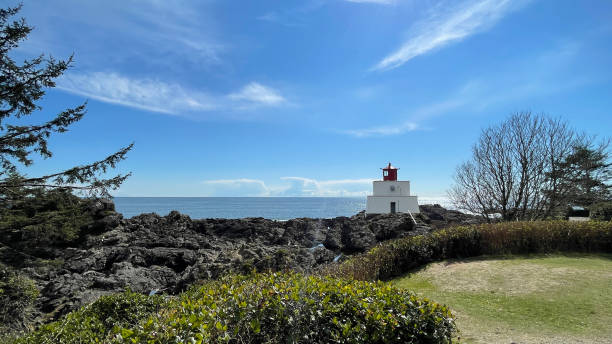 Amphitrite Point Lighthouse at the Ucluelet Wild Pacific Trail Lighthouse Loop on Vancouver Island The Amphitrite Point Lighthouse at the Ucluelet Wild Pacific Trail Lighthouse Loop on Vancouver Island in British Columbia, Canada. east vancouver stock pictures, royalty-free photos & images