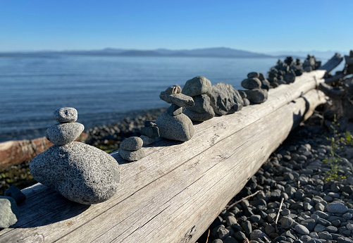 Stacked rock cairns on the beach of Parksville on Vancouver Island in British Columbia, Canada.