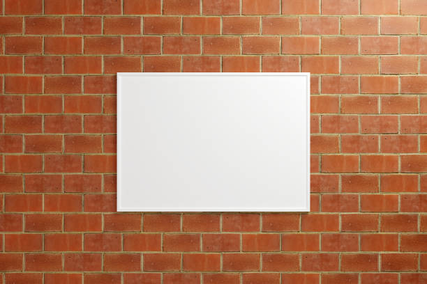 istock Minimalist hanging horizontal white poster or photo frame mockup in brick wall. 3D Rendering. 1665836216