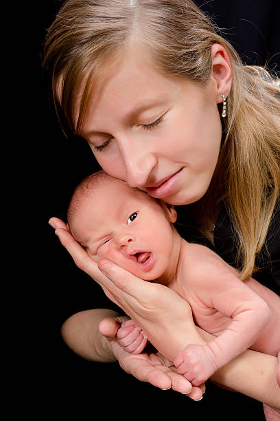 istock Loving mother on black 166584674
