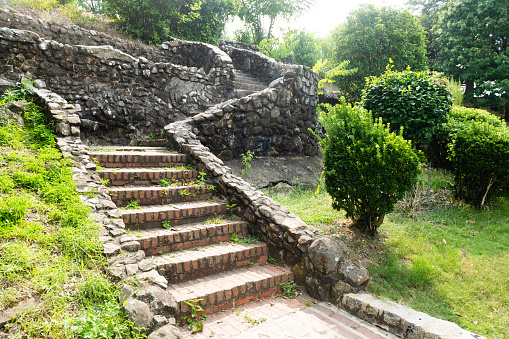 This is a photograph of a stone staircase leading up the hill on a summer day in Washington Park in Macon, Georgia.