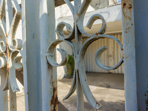 close up of a white iron gate