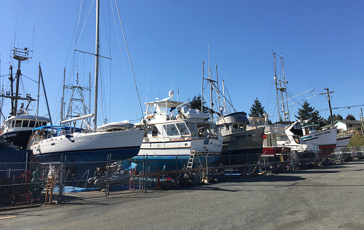 Boats parked at a dry dock near the BC Ferries Departure Bay Terminal on Vancouver Island in Nanaimo, British Columbia, Canada.