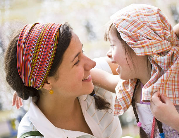 bright picture of hugging mother and daughter happy together, smiling stylish family. lifestyle people concept close up