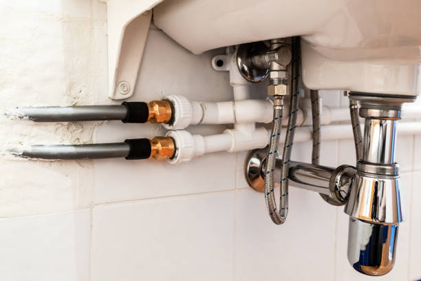 istock connection of various pipes under sink in bathroom 1665857590