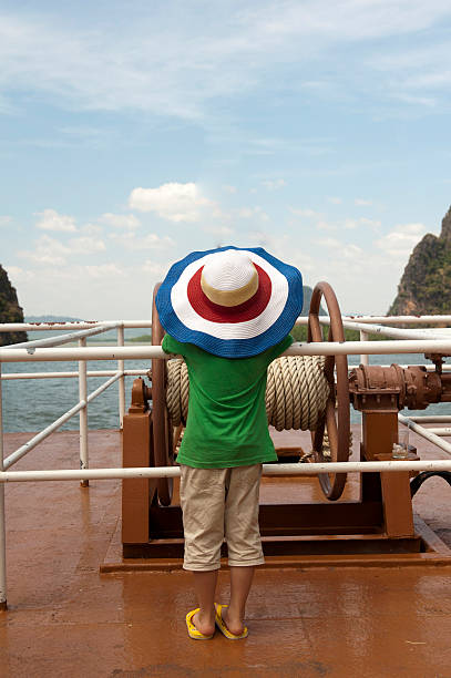 boy is standing on deck boy is standing on deck in  Thailand puket stock pictures, royalty-free photos & images