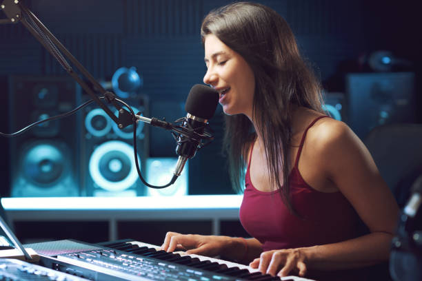 istock Young female artist working in the recording studio 1665902889