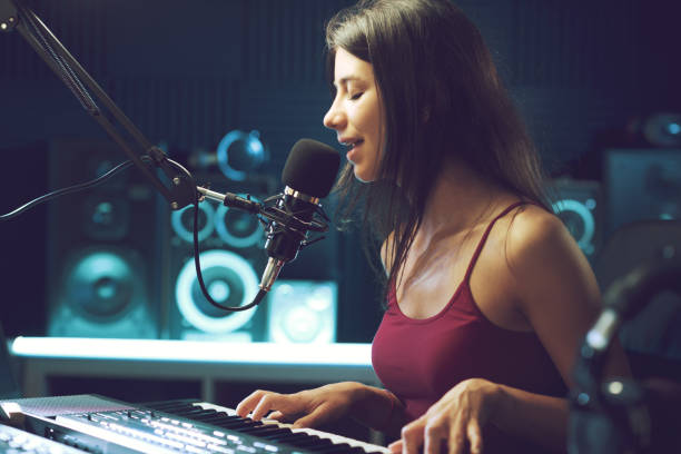istock Young female artist working in the recording studio 1665905069