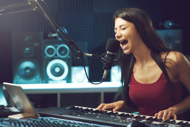 istock Young female artist working in the recording studio 1665906191