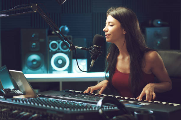 istock Young female artist working in the recording studio 1665906702