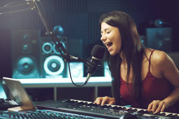 istock Young female artist working in the recording studio 1665908326