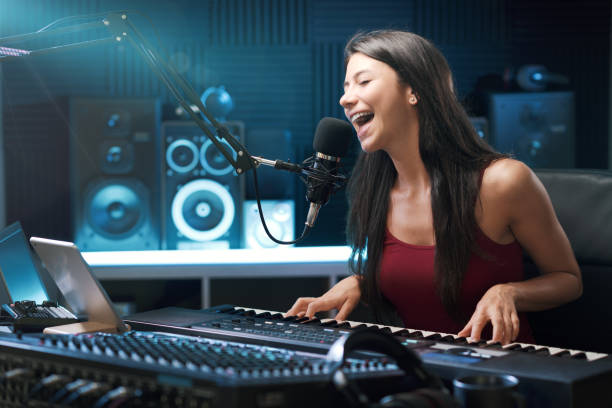istock Young female artist working in the recording studio 1665909965