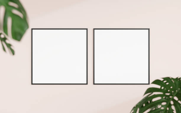 istock Clean and minimalist front view square black photo or poster frame mockup hanging on the wall with blurry plant. 3d rendering. 1665923281