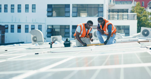 istock Renewable energy, solar panels and engineering team with planning for inspection at sustainable business. Electricity, sustainability and photovoltaic power on rooftop, men in maintenance service. 1665924974