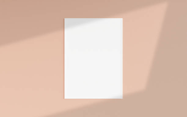 istock Clean and minimalist front view vertical white photo or poster frame mockup hanging on the wall with shadow overlay. 3d rendering. 1665929295
