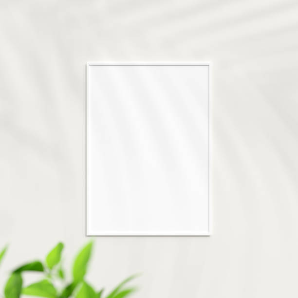 Photo frame mockup on white wall. Poster mockup. Clean, modern, minimal frame. Minimalist background. Blank picture frame mockup. 3d rendering.