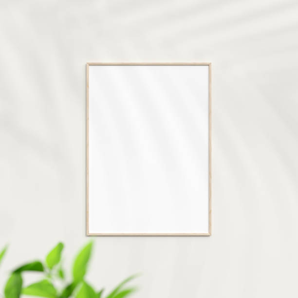 istock Photo frame mockup on white wall. Poster mockup. Clean, modern, minimal frame. Minimalist background. Blank picture frame mockup. 3d rendering. 1665945439
