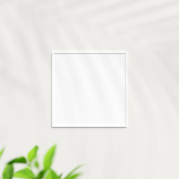 istock Photo frame mockup on white wall. Poster mockup. Clean, modern, minimal frame. Minimalist background. Blank picture frame mockup. 3d rendering. 1665945454