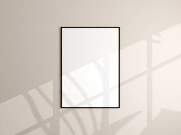 istock Photo frame mockup hanging on beige wall. Minimalist background. Blank picture frame mockup in living room. Poster mockup. Clean, modern, minimal frame. 3d rendering. 1665954754