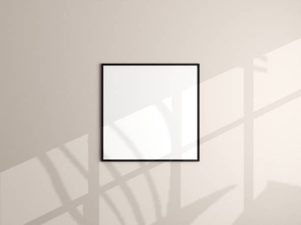 istock Photo frame mockup hanging on beige wall. Minimalist background. Blank picture frame mockup in living room. Poster mockup. Clean, modern, minimal frame. 3d rendering. 1665955202