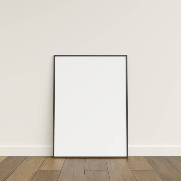 istock Empty picture frame on wooden floor leaning against wall. Blank poster frame standing on wooden floor. Blank poster frame mockup. Empty picture frame mockup. 3d rendering. 1665955300