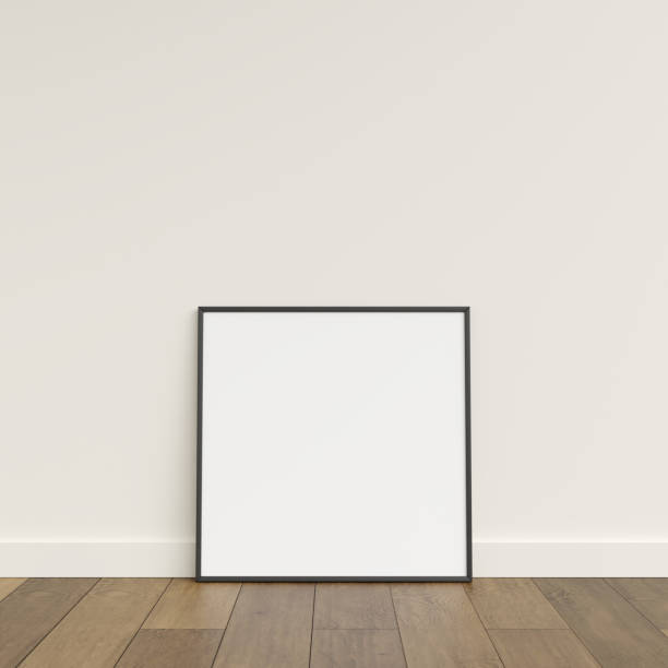 istock Empty picture frame on wooden floor leaning against wall. Blank poster frame standing on wooden floor. Blank poster frame mockup. Empty picture frame mockup. 3d rendering. 1665955330